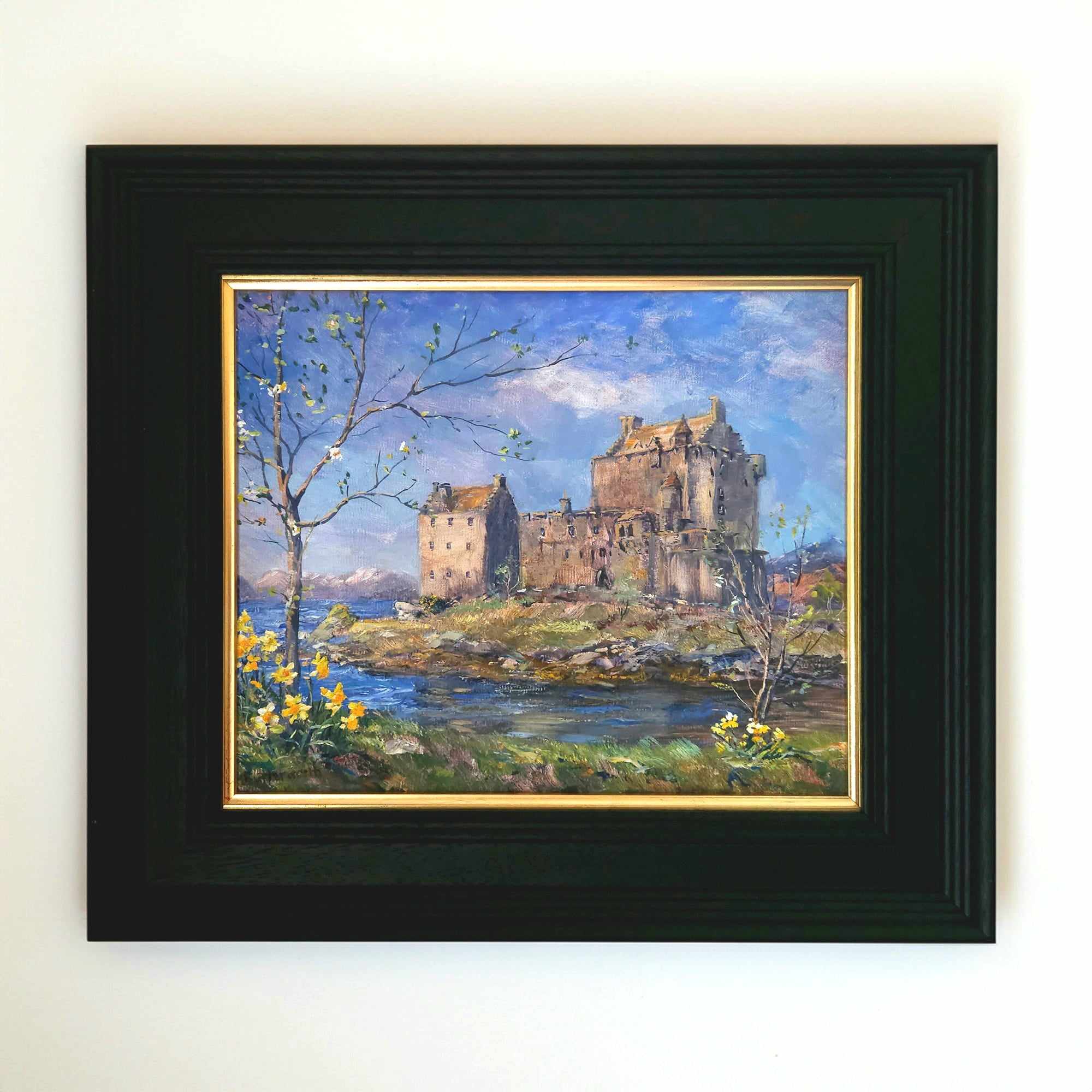 Spring sunshine on Eilean Donan Castle, with daffodils on the banks of Loch Duich in the Scottish Highlands.by artist Howard Butterworth